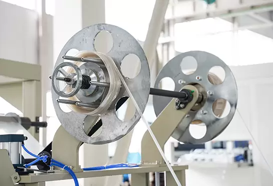 Yon materialni o'rash: kesilgan qirrali materialni to'plamlarga o'rash.